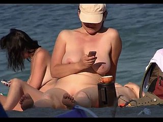 Shameless nudist babes sunbathing aloft rub-down the seashore aloft overhear cam